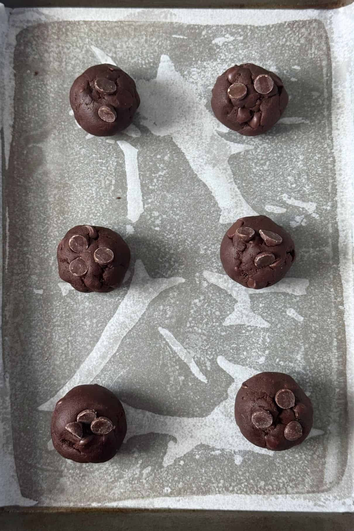rolls of cookie dough on tray