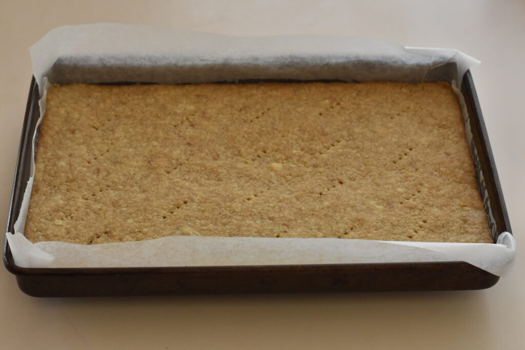 Baked slice base in tray.