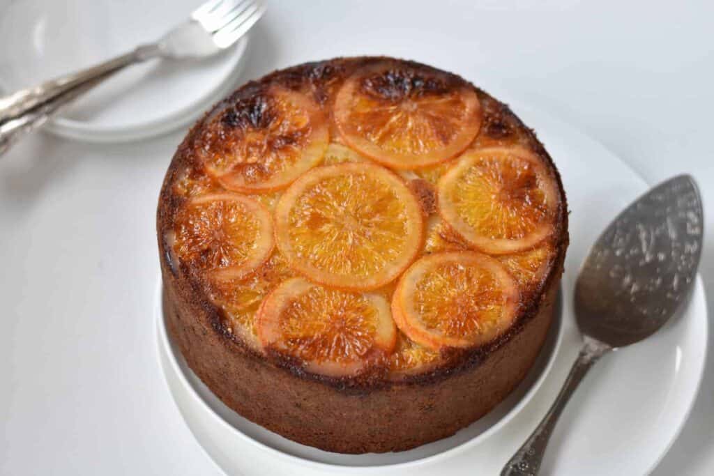Plated hazelnut cake with candied oranges.