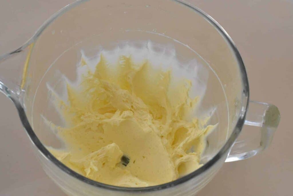 Cream cheese and butter creamed together in electric mixer bowl.