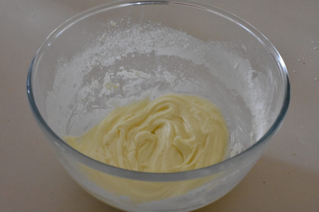 Lemon icing combined in a bowl.