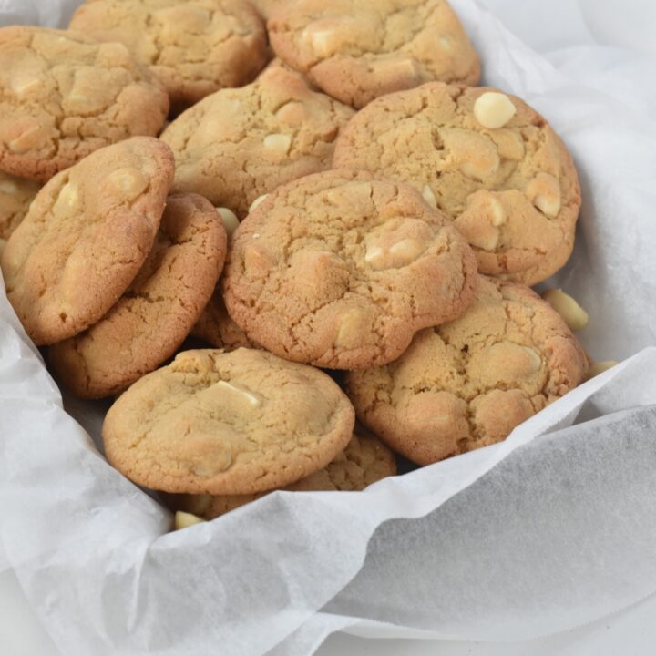 White Chocolate Macadamia Nut Cookies sitting in a pile.