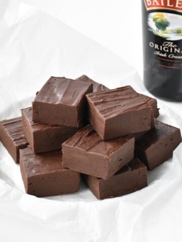 Squares of Baileys Fudge on a plate.