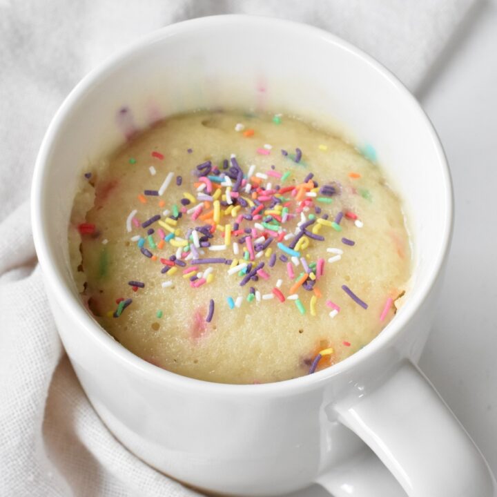 Cooked funfetti mug cake with sprinkles.