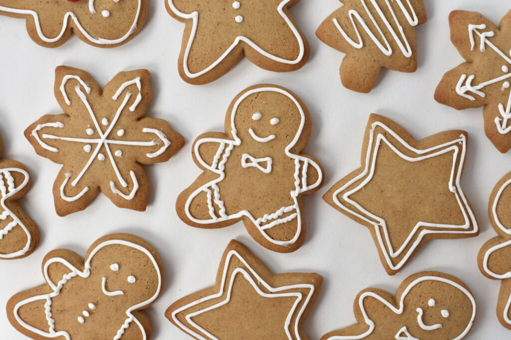Decorated Gingerbread Cookies on Baking Paper