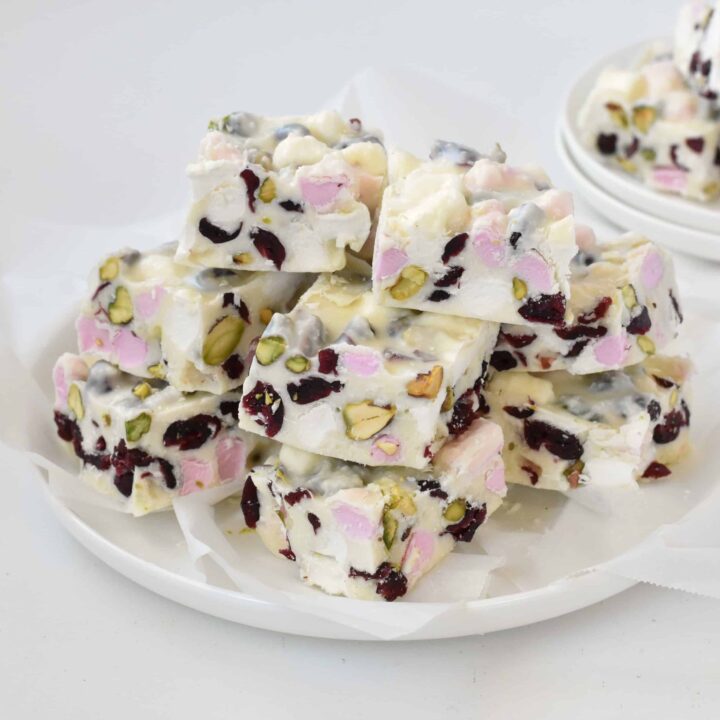 Squares of White Christmas Rocky Road on a plate.