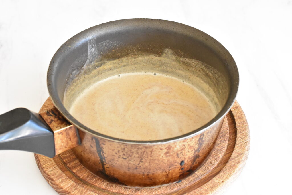 Saucepan of hot latte mix.