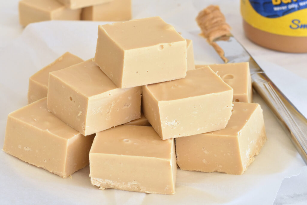 Squares of PB fudge on a plate.
