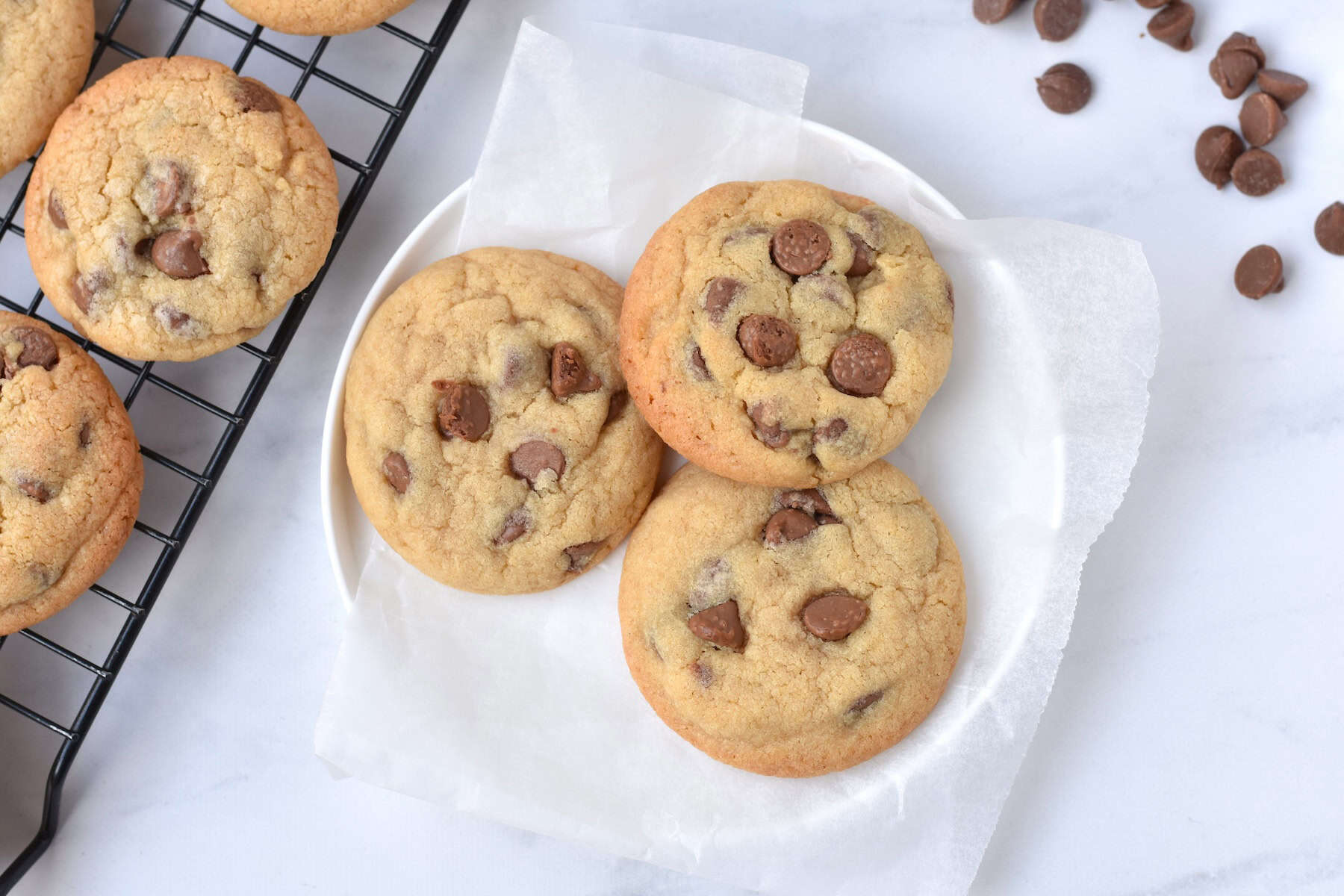 Three cookies on a plate.