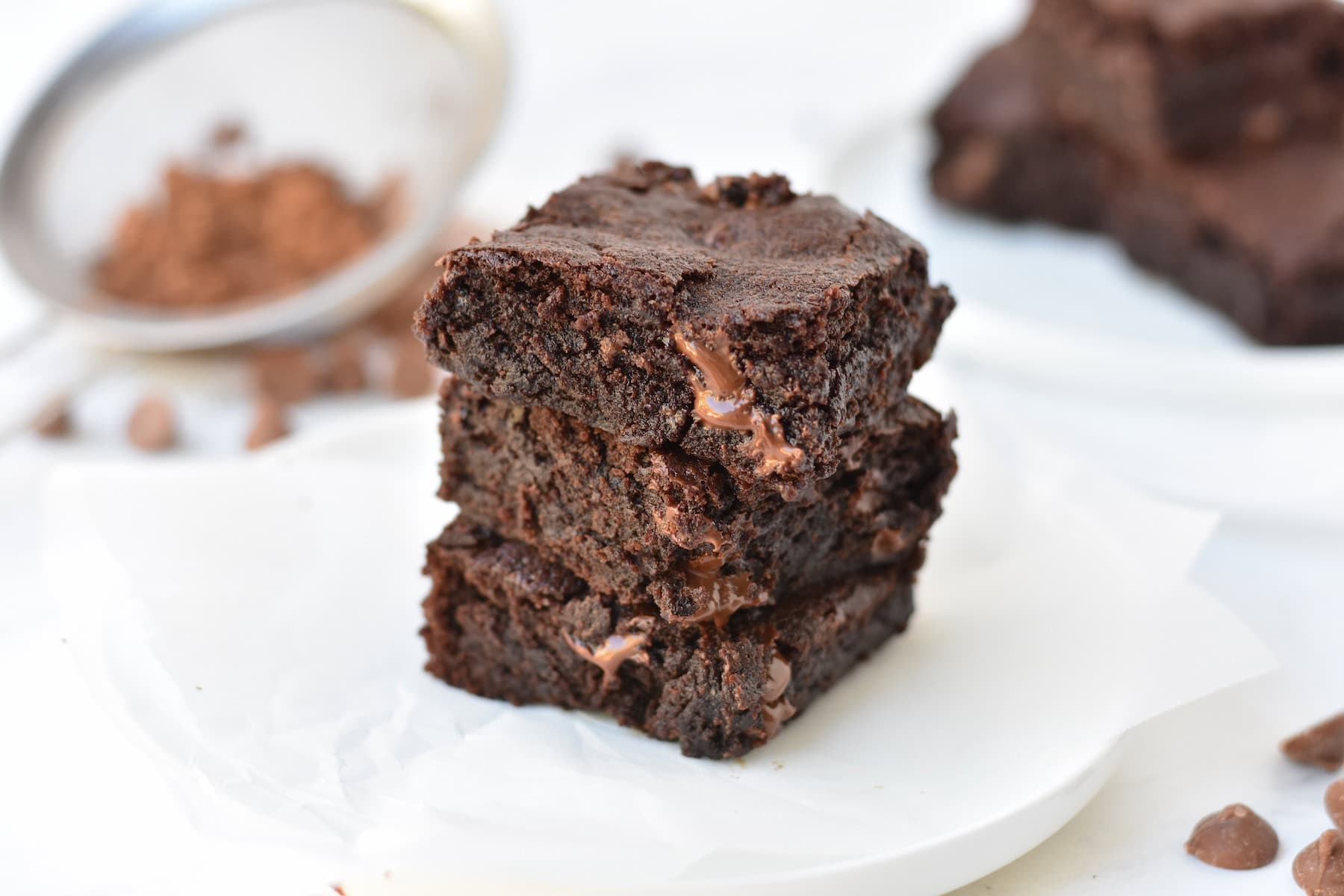Three brownies stacked on top of each other.