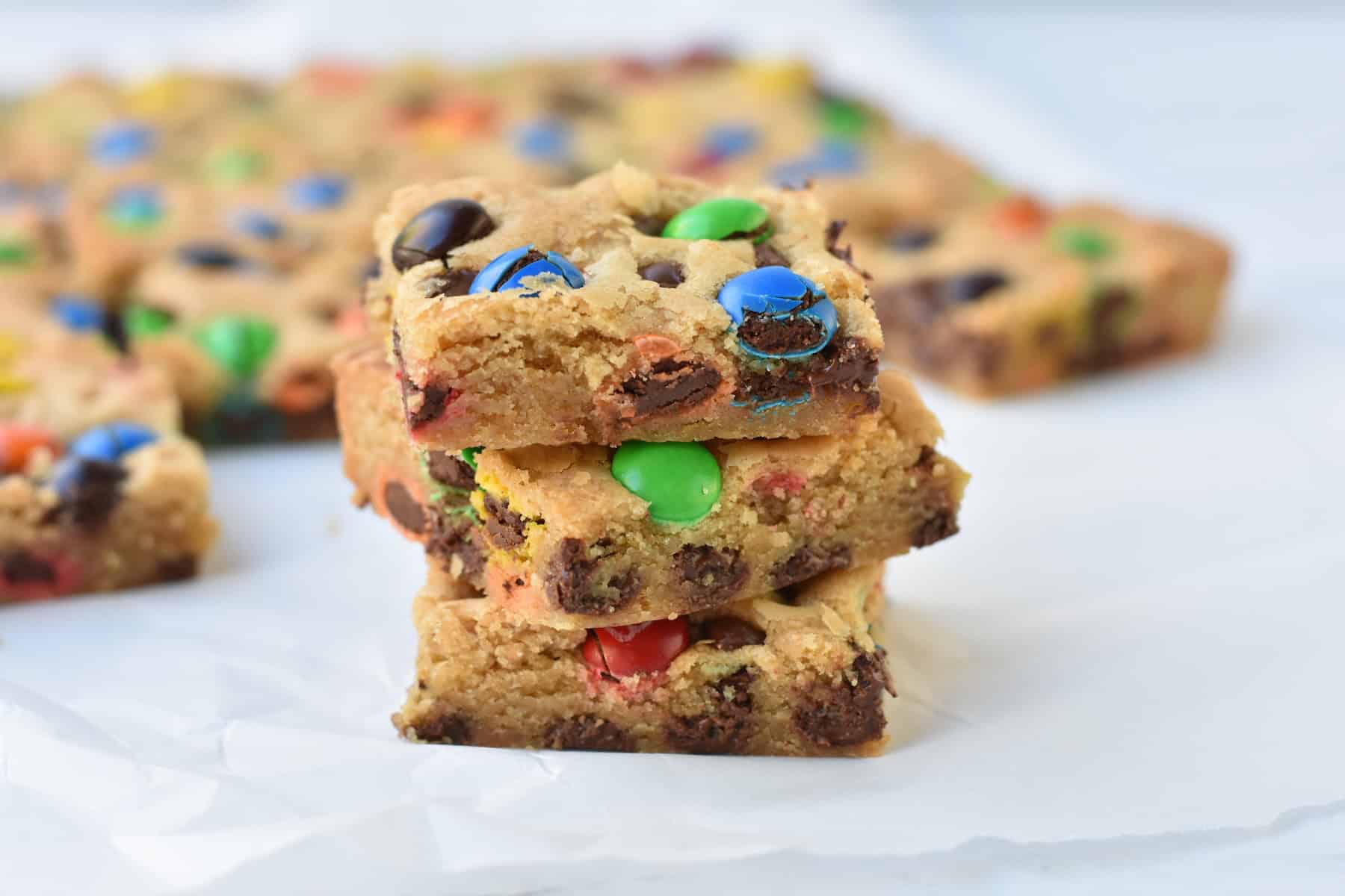 Squares of cookie bar stacked.