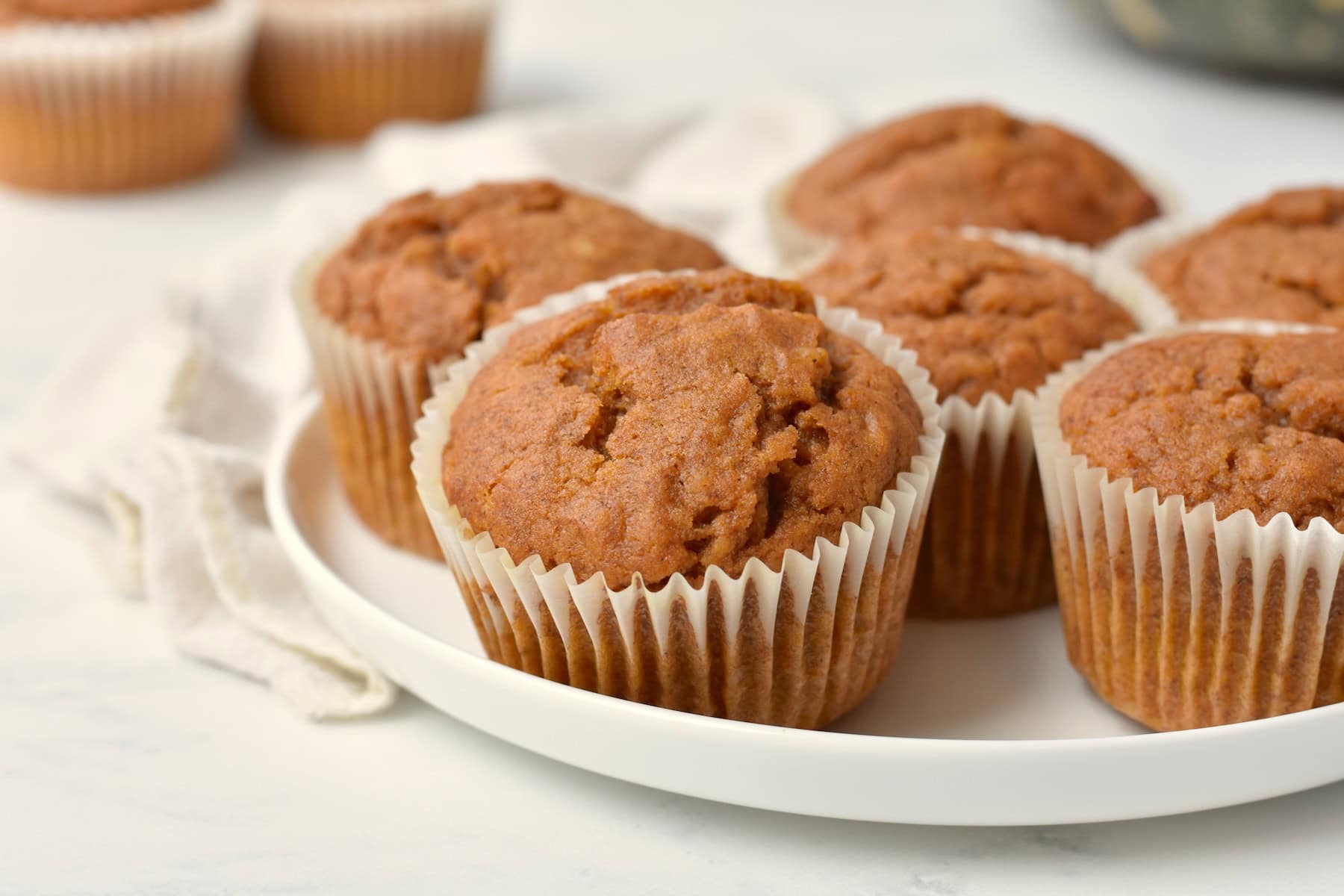 Pumpkin muffins on a plate.