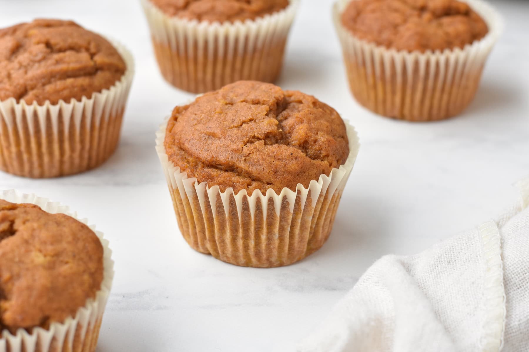 Pumpkin muffins on bench.