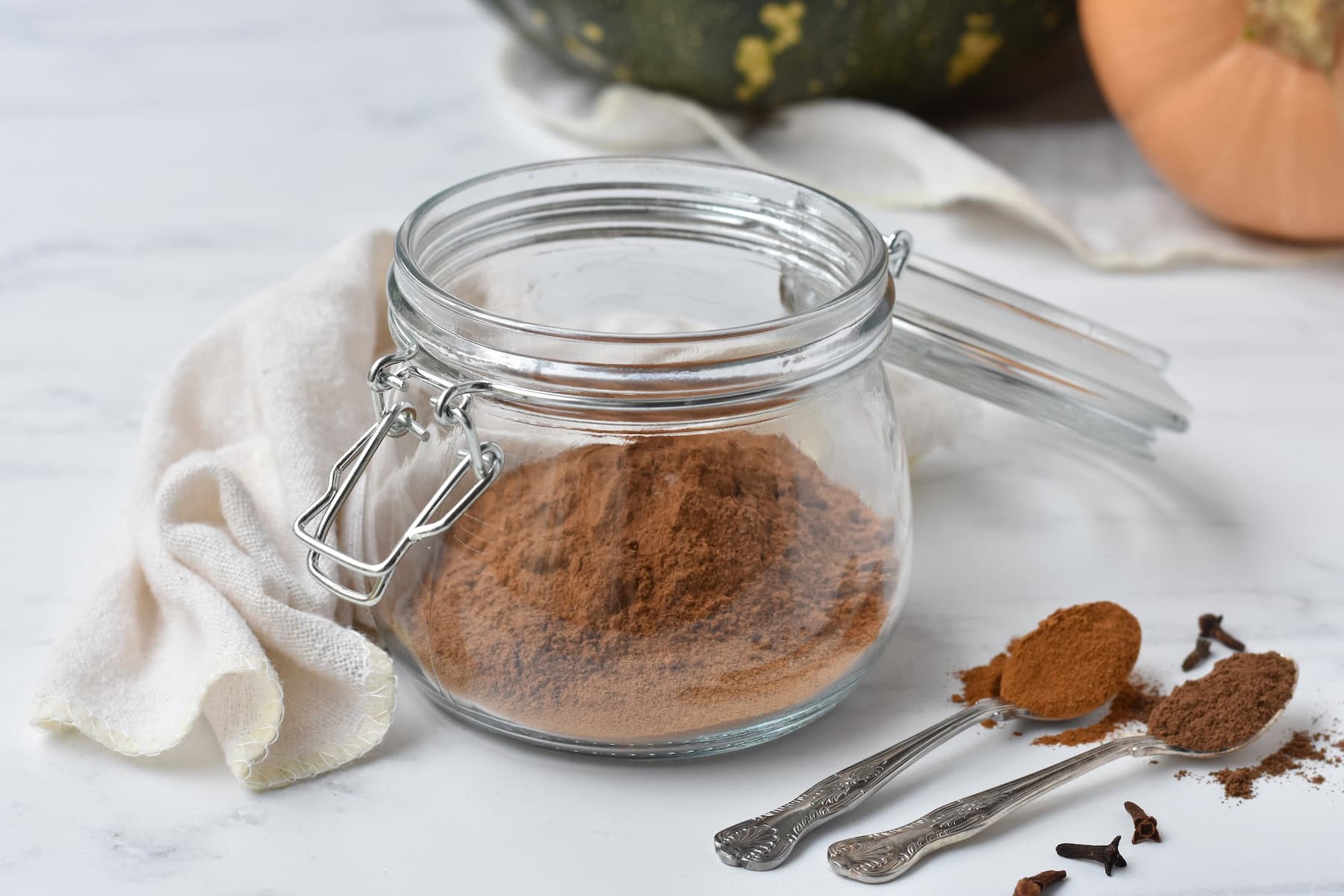 Pumpkin spice mix in a large glass jar.