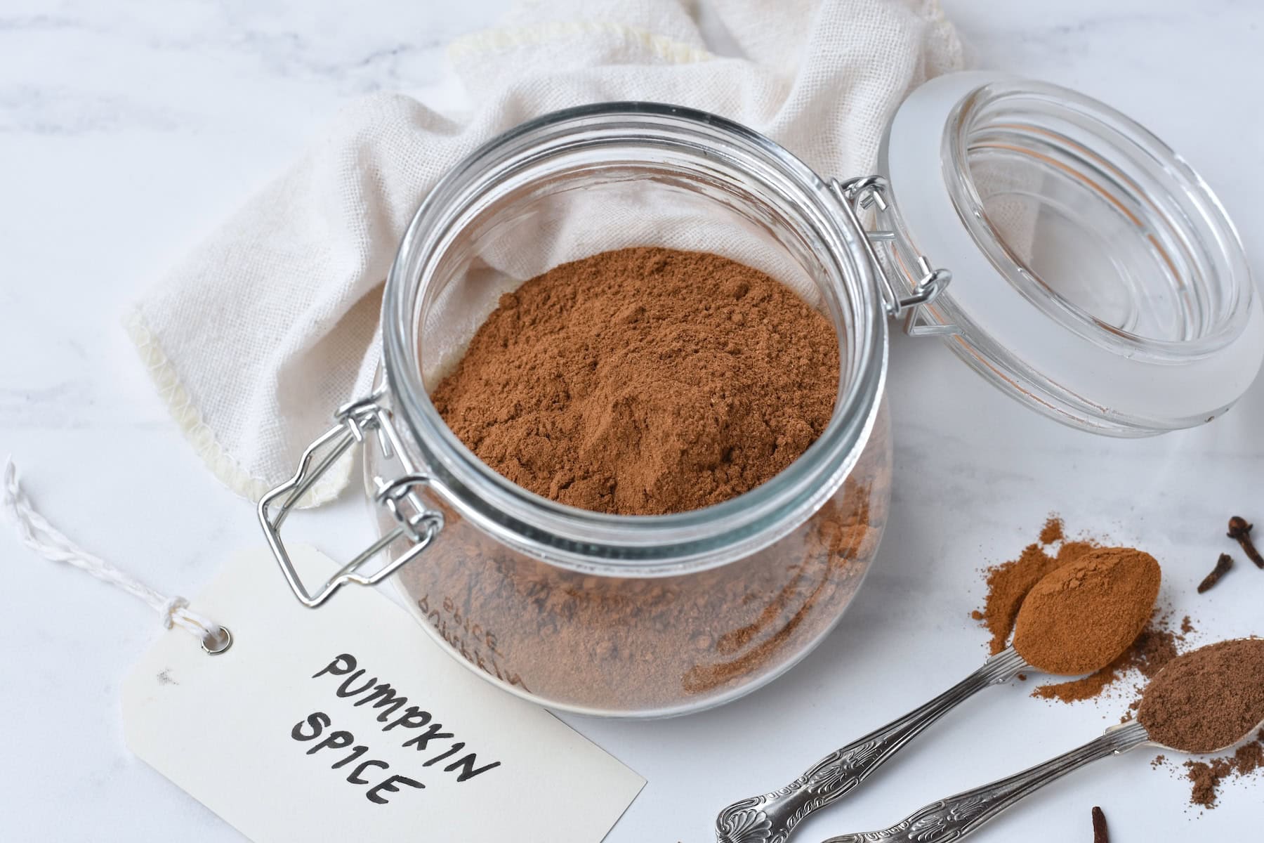 Pumpkin spice mix in a large glass jar.
