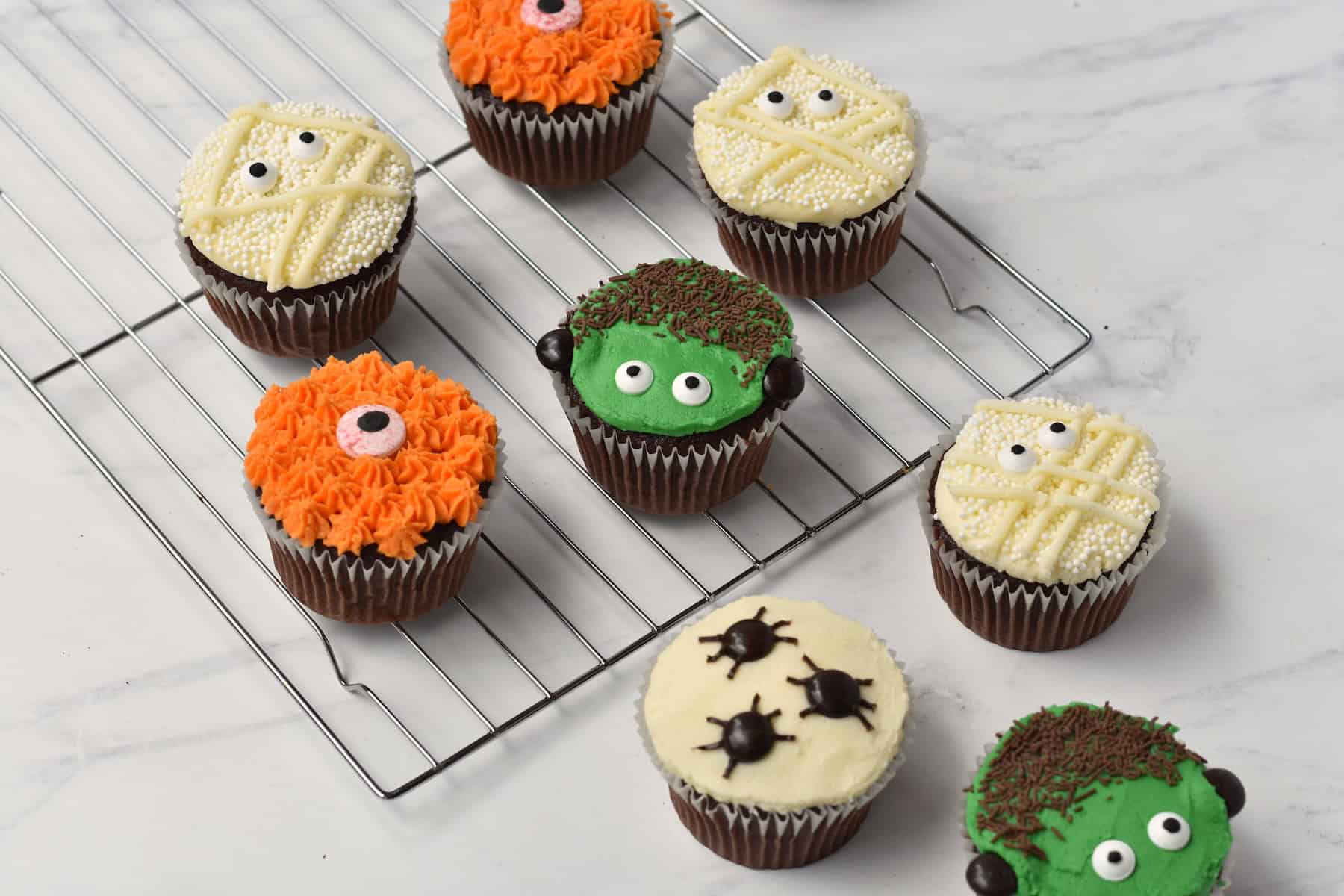 Halloween cupcakes on baking tray.