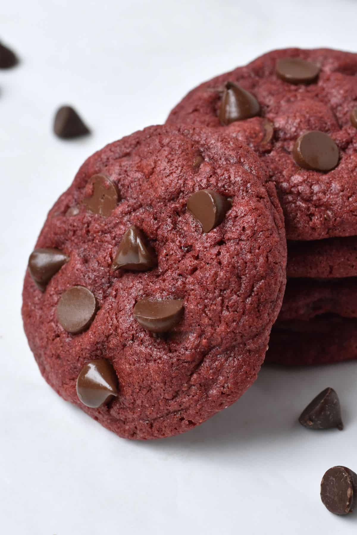 Close up of stack of four red velvet cookies.